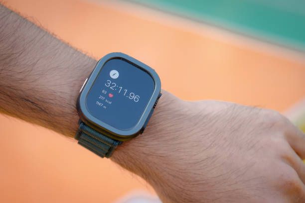 Smartwatch displaying health vitals and digital health monitoring apps for travelers