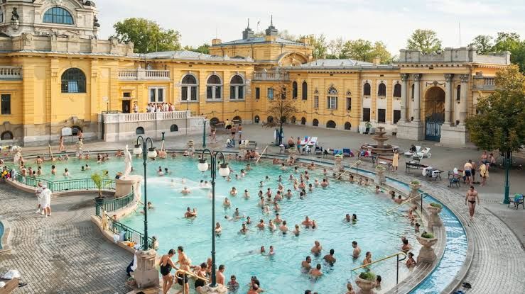 Medical students relaxing by the Danube river in Budapest, Hungary
