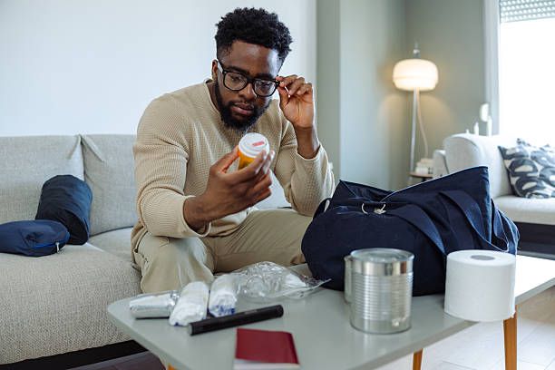 Traveler reviewing medications and pre-existing condition coverage
